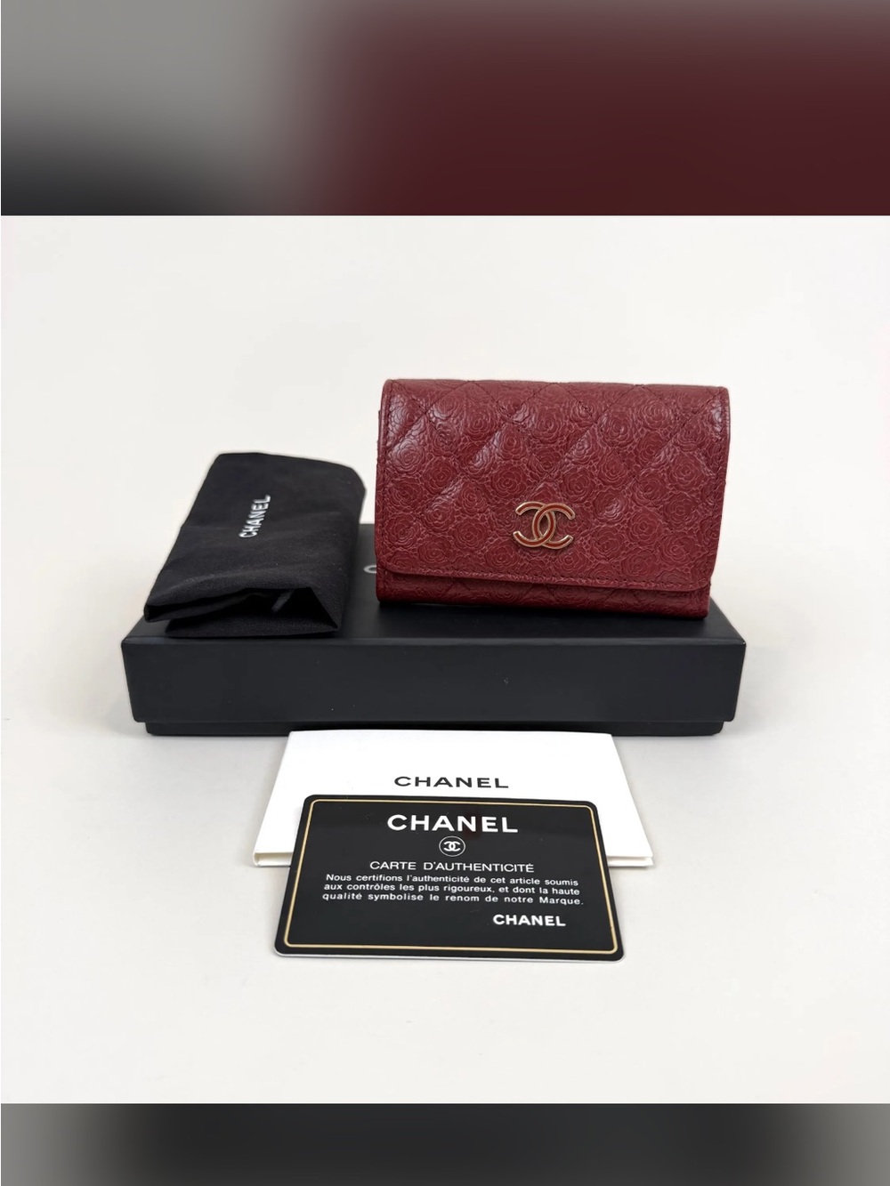 Rare Burgundy CHANEL Camelia embossed card wallet